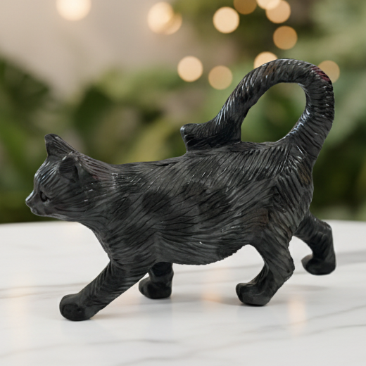 Black cat carving with marble bokeh background