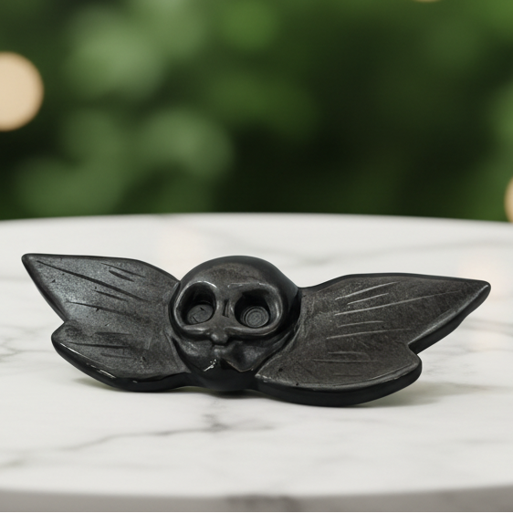 Obsidian owl with marble bokeh background